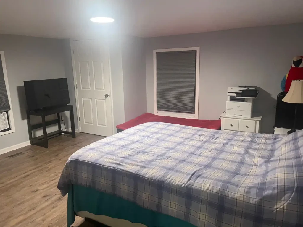Clean bedroom showing the benefits of house cleaning services